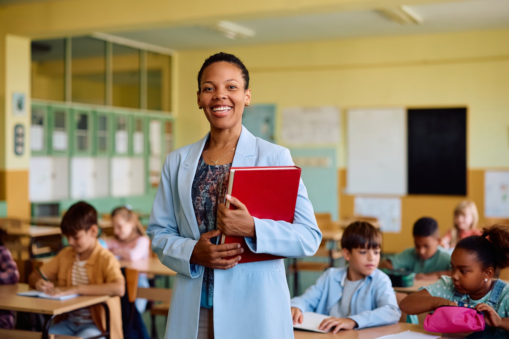happy-black-teacher-during-a-class-at-elementary-s-2025-06-25-19-57-23-utc